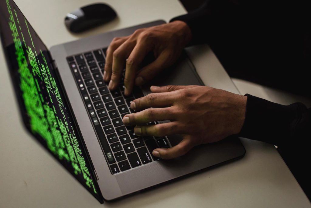 website-attack-hacking-typing-laptop