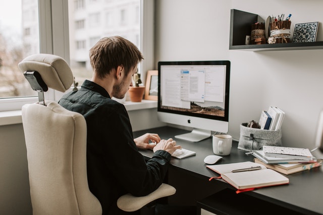 photo-of-man-using-computer