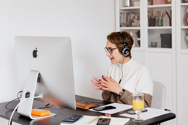 positive-woman-having-video-call-on-computer