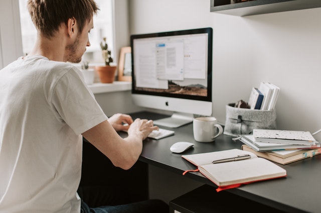 photo-of-man-using-computer