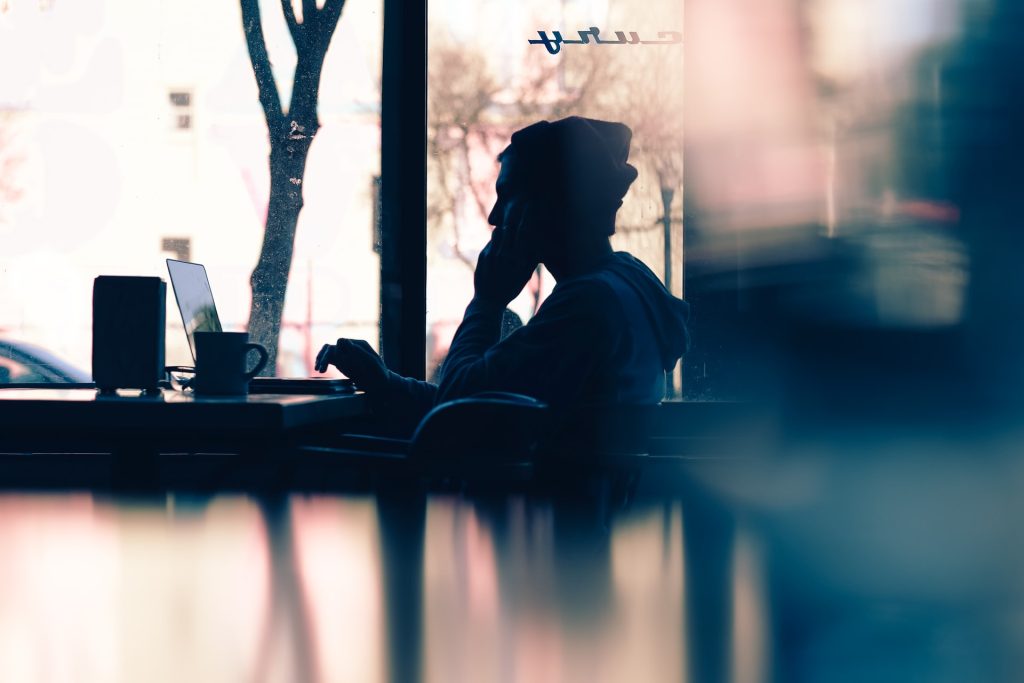 man-sitting-in-front-of-laptop